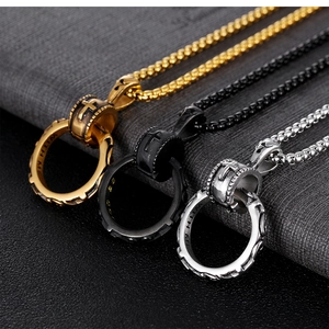 Detailed close-up of retro cross pendant necklaces in gold, silver, and black steel