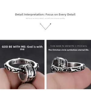 Macro view of retro silver cross ring with BE WITH ME engraving and scroll patterns