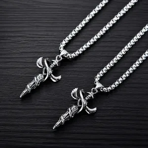 Macro detail of gothic sword pendant with box chain and vintage silver finish