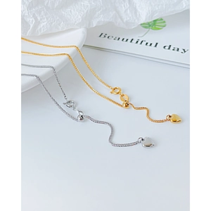 Elegantes collares de acero de titanio con colgante de corazón en oro y plata