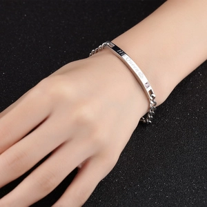 Detail of His Queen engraving on titanium steel couple bracelet with purple crystal