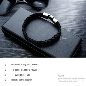 Close-up of black braided leather bracelet with silver alloy clasp and size markers