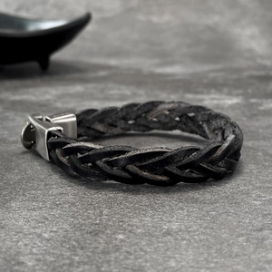 Handwoven black leather bracelet with a matte silver stainless steel magnetic clasp