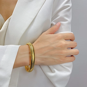 Fashionable gold-plated stainless steel cuff bracelet with a textured snake bone design