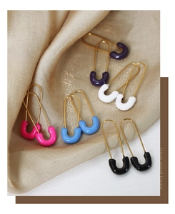 Detail view of colorful enamel safety pin earrings in gold-tone stainless steel