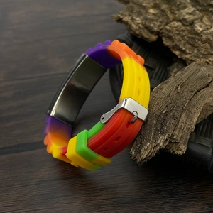 Macro view of rainbow silicone bracelet with stainless steel buckle and matte texture finish