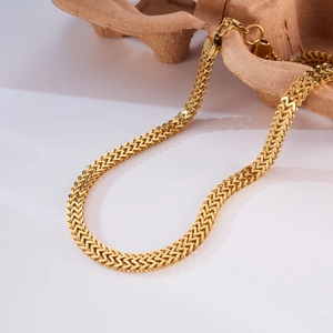 Macro shot of gold plated stainless steel Franco chain with secure lobster clasp