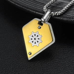 Detailed close-up of a two-tone shield pendant with gear design and box chain necklace