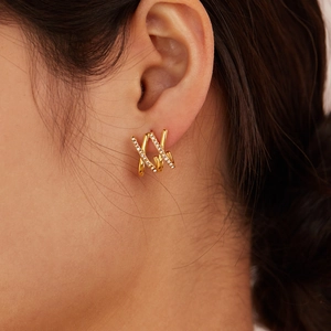 Luxe zircon gold earrings featuring a geometric criss-cross design in titanium steel