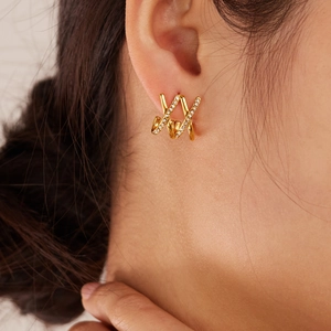 Elegant gold titanium steel X-shape crisscross stud earrings with pavé cubic zirconia