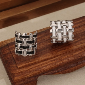 Unique geometric woven titanium steel ring with colored enamel finish in black and white