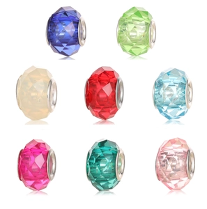 Macro shot of colorful faceted resin beads with silver metal cores for DIY jewelry