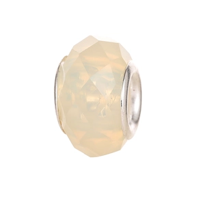 Close-up of faceted cream yellow resin bead with silver core for DIY jewelry making