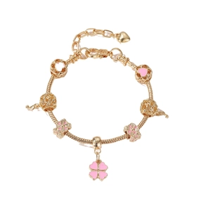 Gold snake chain charm bracelet with pink enamel clover and floral pendants