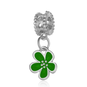 Macro detail of cherry blossom charm with green enamel petals and white zircon inlay