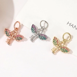 Cartoon colorful enamel wing key charms in rose gold, silver and gold metal finishes