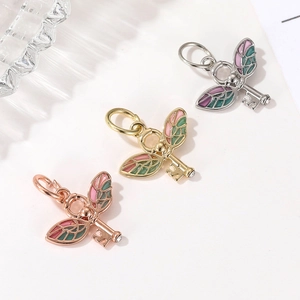 Colorful wing key pendant necklaces with enamel finish in silver, gold and rose gold