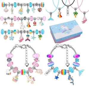 Detail of DIY kids mermaid and unicorn charm jewelry set with colorful beads and gift box