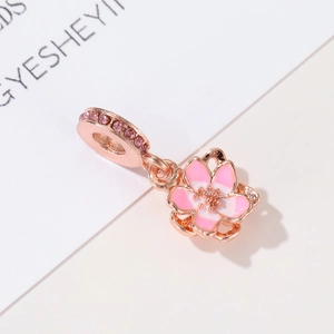 Rose gold cherry blossom charm pendant with pink enamel and sparkling crystals