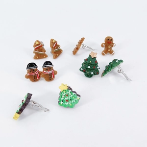Cute Christmas resin clip-on earring set featuring gingerbread men and holiday trees