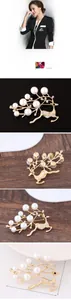 Detailansicht der matten Gold-Hirschbrosche mit eleganten weißen Perlen und Diamanten