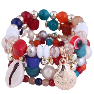 Boheems gelaagd kralenarmbandje met schelphangers en evil eye details in diverse kleuren