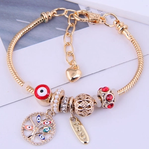Bracciale bohémien dorato con malocchio, ciondolo albero della vita e perle colorate