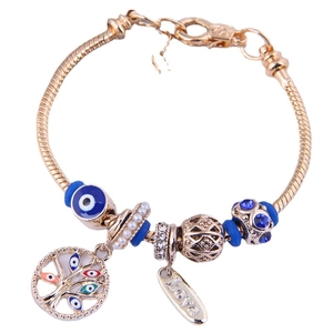 Bracciale boho a maglia serpente dorata con perle malocchio e albero della vita