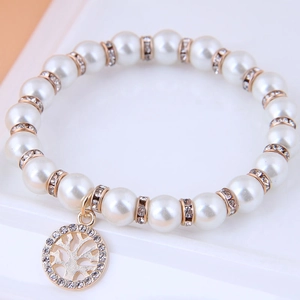 Elegant beaded bracelet with white pearls, gold spacers and Tree of Life charm
