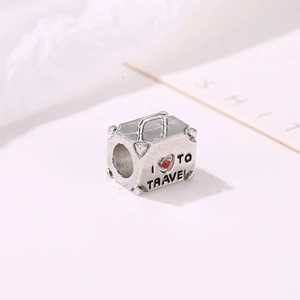 Silver suitcase travel charm with I Love To Travel engraving for charm bracelets
