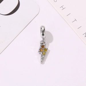 Detailed macro view of lightning bolt charm with colorful inlaid stones for DIY jewelry