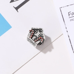 Vintage silver gingerbread house charm with red and white candy cane details for DIY bracelets