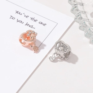 Rose gold and silver heart-shaped paw print beads with Fur Mom engraving for DIY bracelets