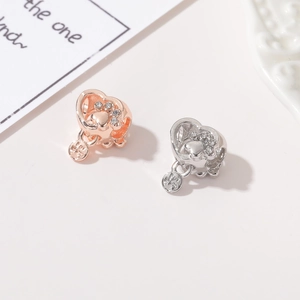 Rose gold and silver hollow heart charms with sparkling pet paw print design and tiny tag
