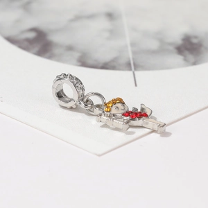 Cartoon dancing girl charm for DIY bracelets with red and amber crystals in silver finish