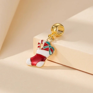 Detail of Christmas boot pendant with red enamel, candy cane, and golden charm loop