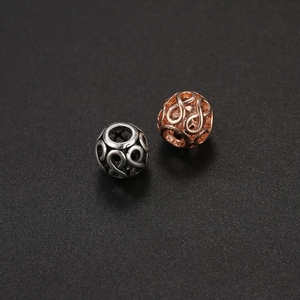 Cuentas huecas de infinito en oro rosa y plata antigua para hacer joyas artesanales