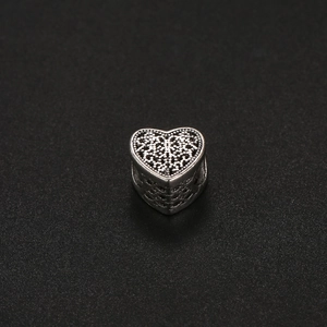 Hollow heart charm bead in vintage silver finish with bohemian patterns for DIY jewelry