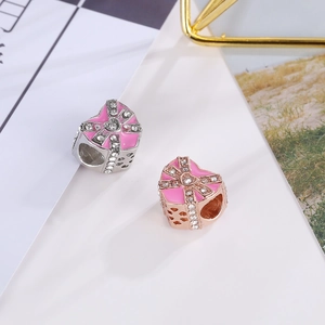 Pink enamel heart gift box charms with rhinestone bows in silver and rose gold