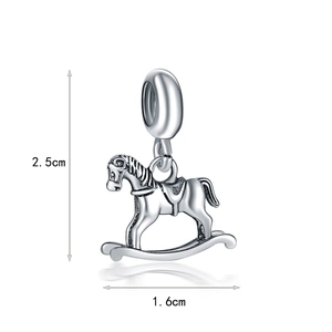 Macro detail of vintage silver rocking horse pendant with 2.5cm height and 1.6cm width
