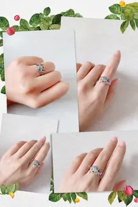 Dettaglio dell'anello a unicorno regolabile con cristalli di zirconia arcobaleno al dito