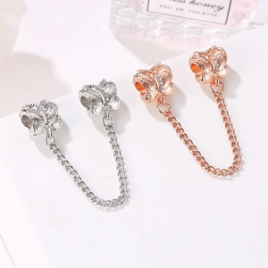 Catena di sicurezza a farfalla con micro-cristalli in finitura argento e oro rosa