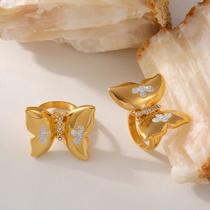 Exaggerated butterfly rings set in PVD gold plated stainless steel with pave crystals