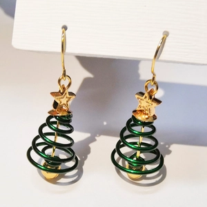 Christmas tree drop earrings with gold stars and green spiral cones on a white card