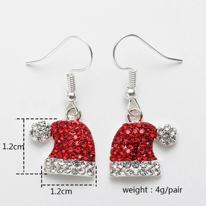 Detail view of sparkling Christmas hat drop earrings with red and white rhinestones