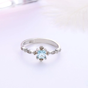 Elegant S925 silver ring featuring a square blue aquamarine stone and side diamonds