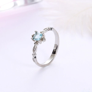 Elegant S925 silver ring featuring a square-cut aquamarine and sparkling side stones