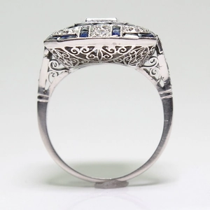 Art Deco square blue sapphire ring with diamonds and filigree in white gold finish