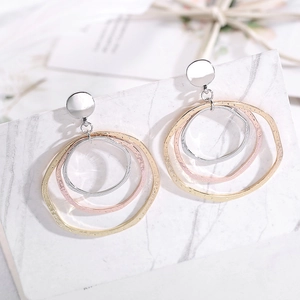 Three-tone geometric layered hoop earrings in gold silver and rose gold with hammered texture