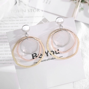 Modern irregular triple hoop earrings in gold, rose gold and silver textured metal